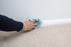 Cleaning skirting boards with cloth