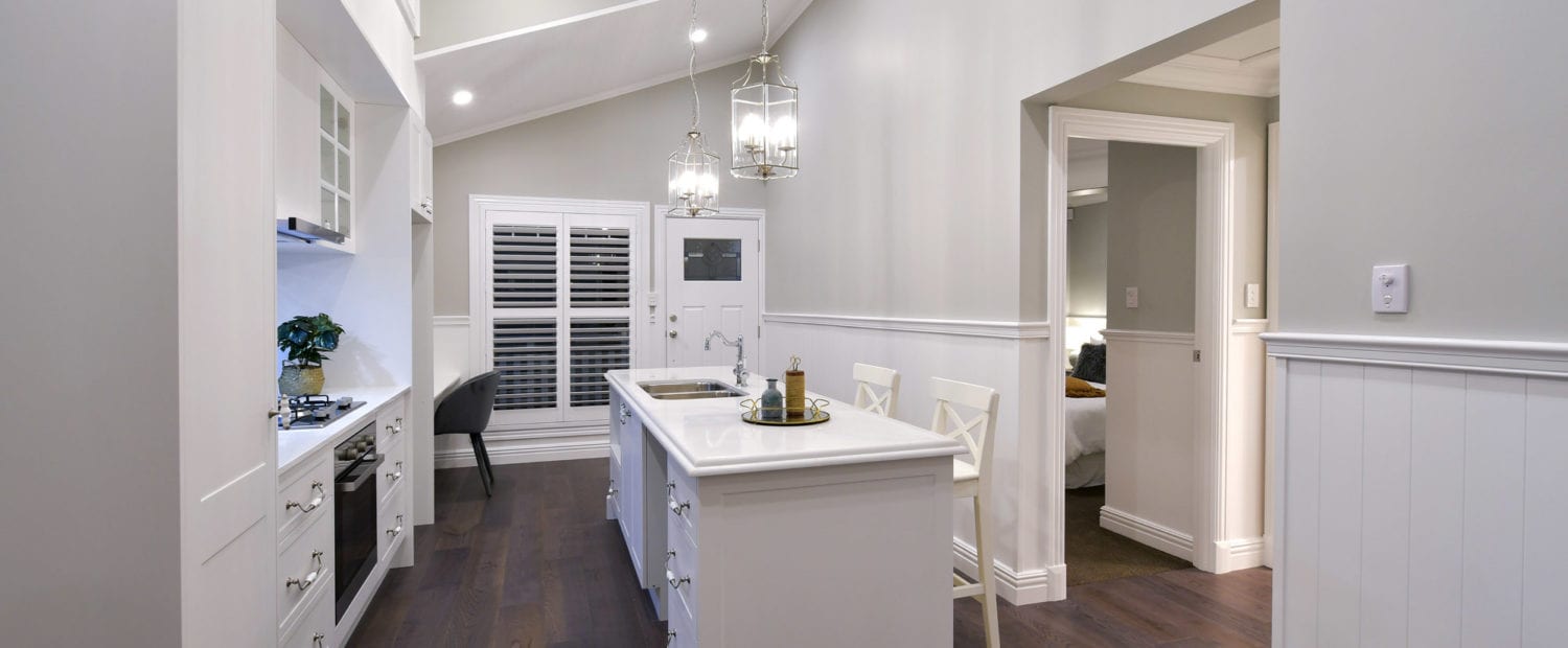 Luxury kitchen and hallway featuring classic dado rails and VJ wall panelling, creating elegant wall division and timeless architectural detail.