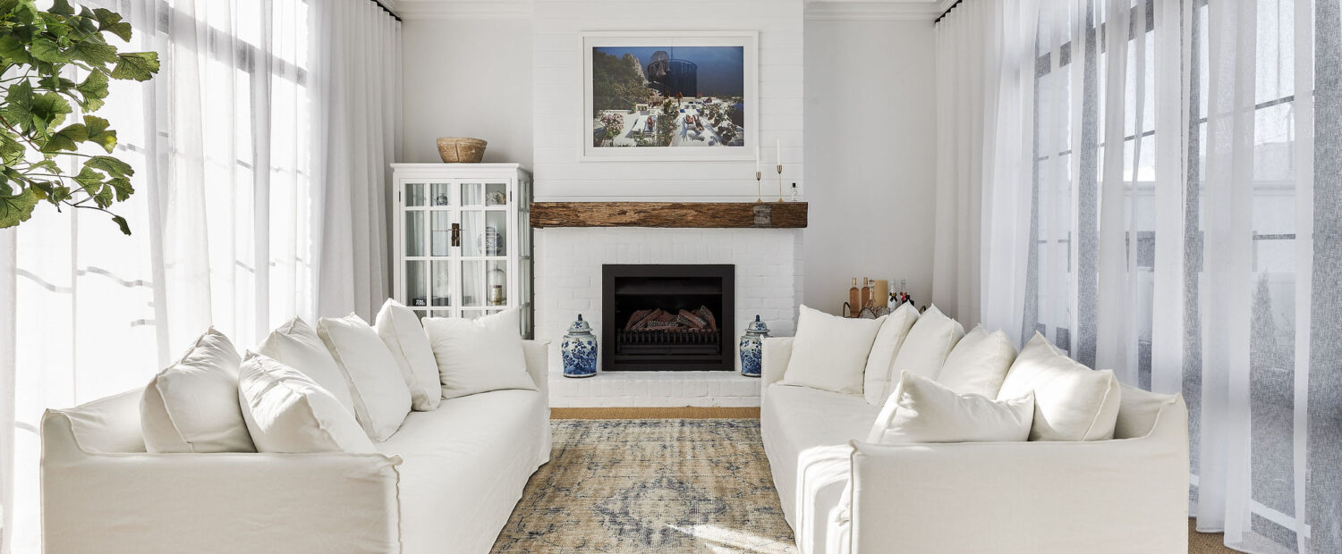 A stunning modern farmhouse-style lounge room blending old and new elements.