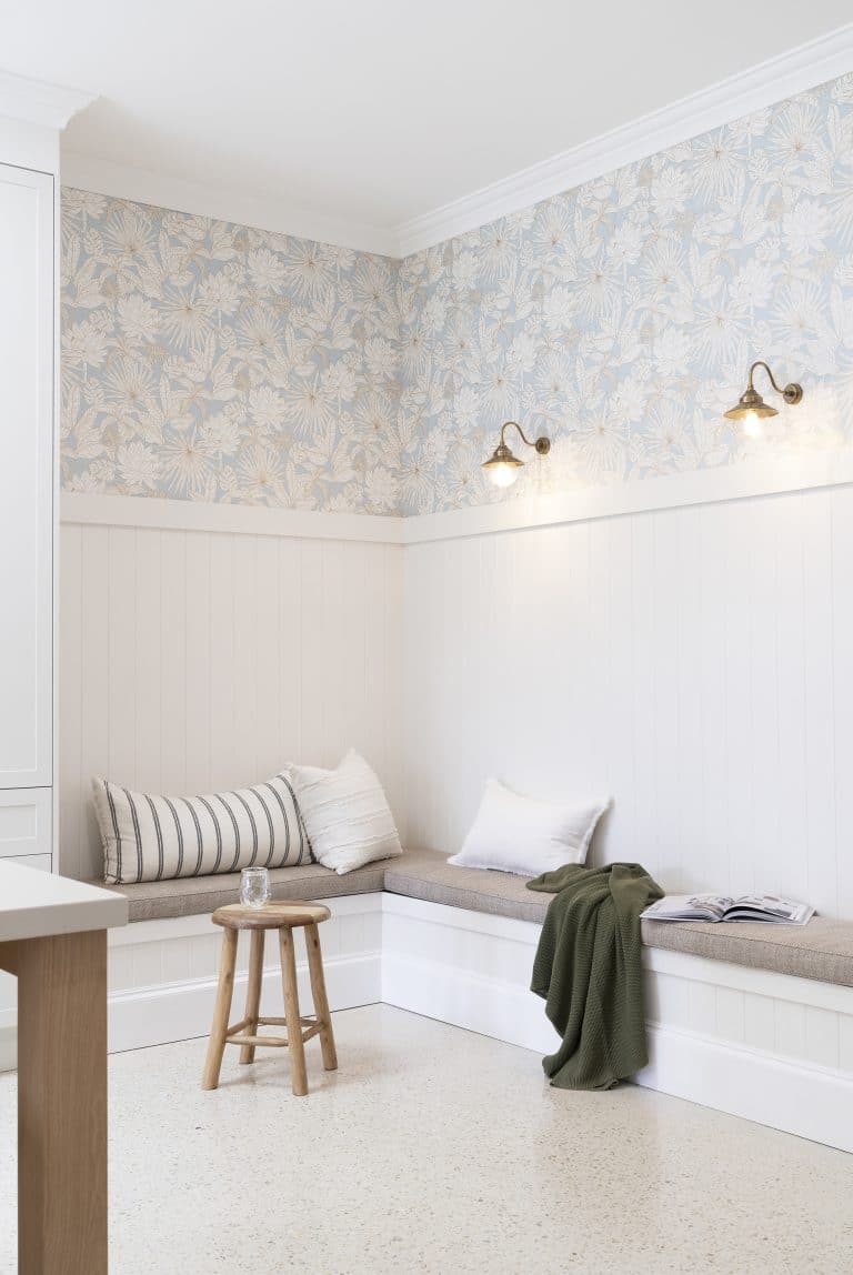 A cosy corner book with timber wall panelling.