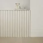 Minimalist interior featuring half round mouldings for soft, curved detailing