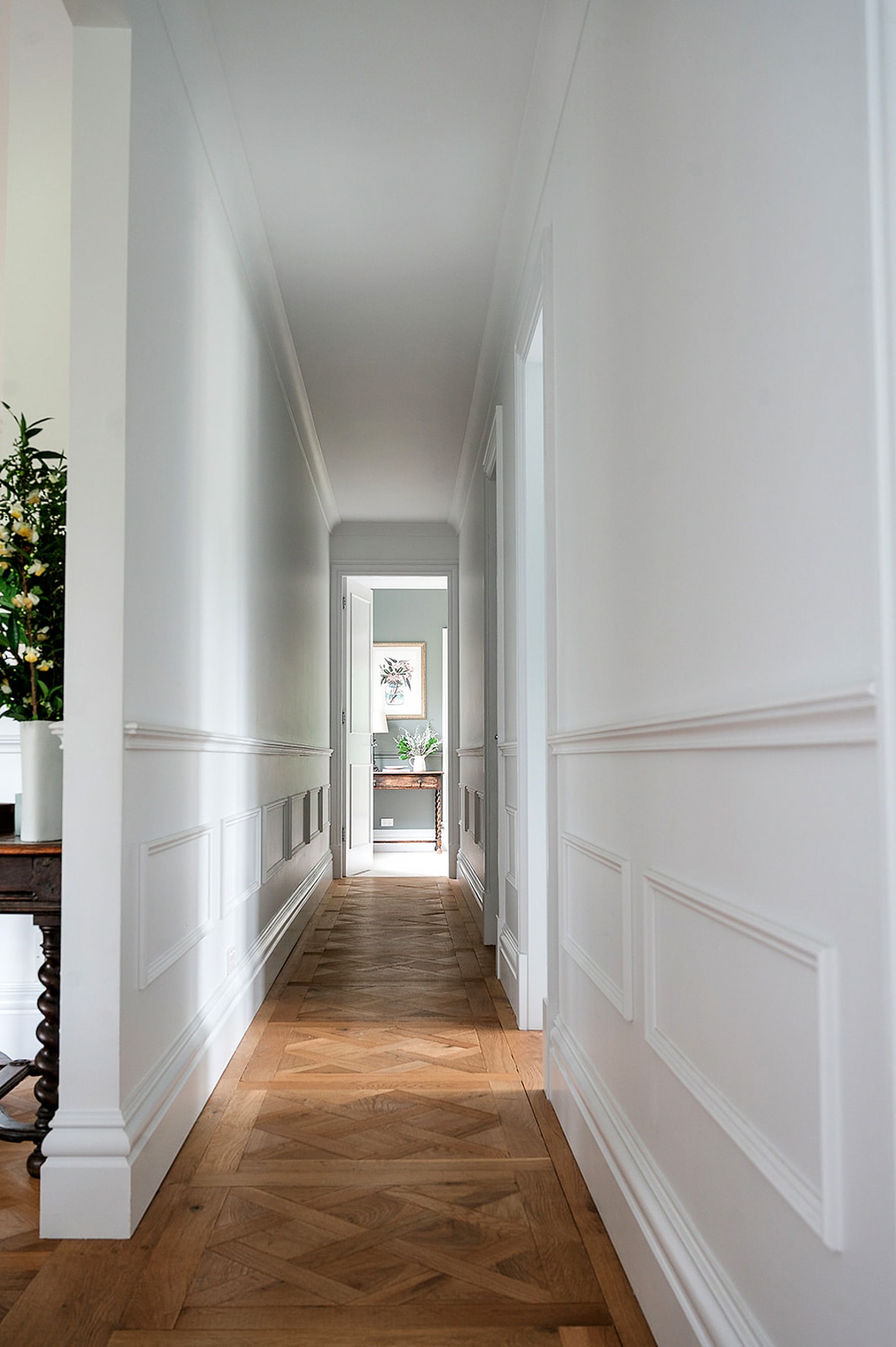 Hallway featuring decorative wall panelling, dado rail moulding, and detailed timber skirting boards in a classic Australian interior