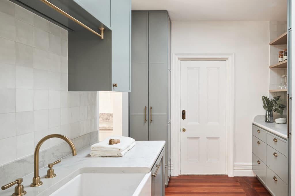 Laundry with high ceilings, decorative cornices, and arched transitions—Intrim mouldings define spatial hierarchy and elevate first impressions.