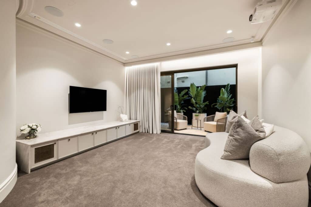 Contemporary minimalist room with natural light, smooth wall finishes, and Intrim skirting boards enhancing the space.