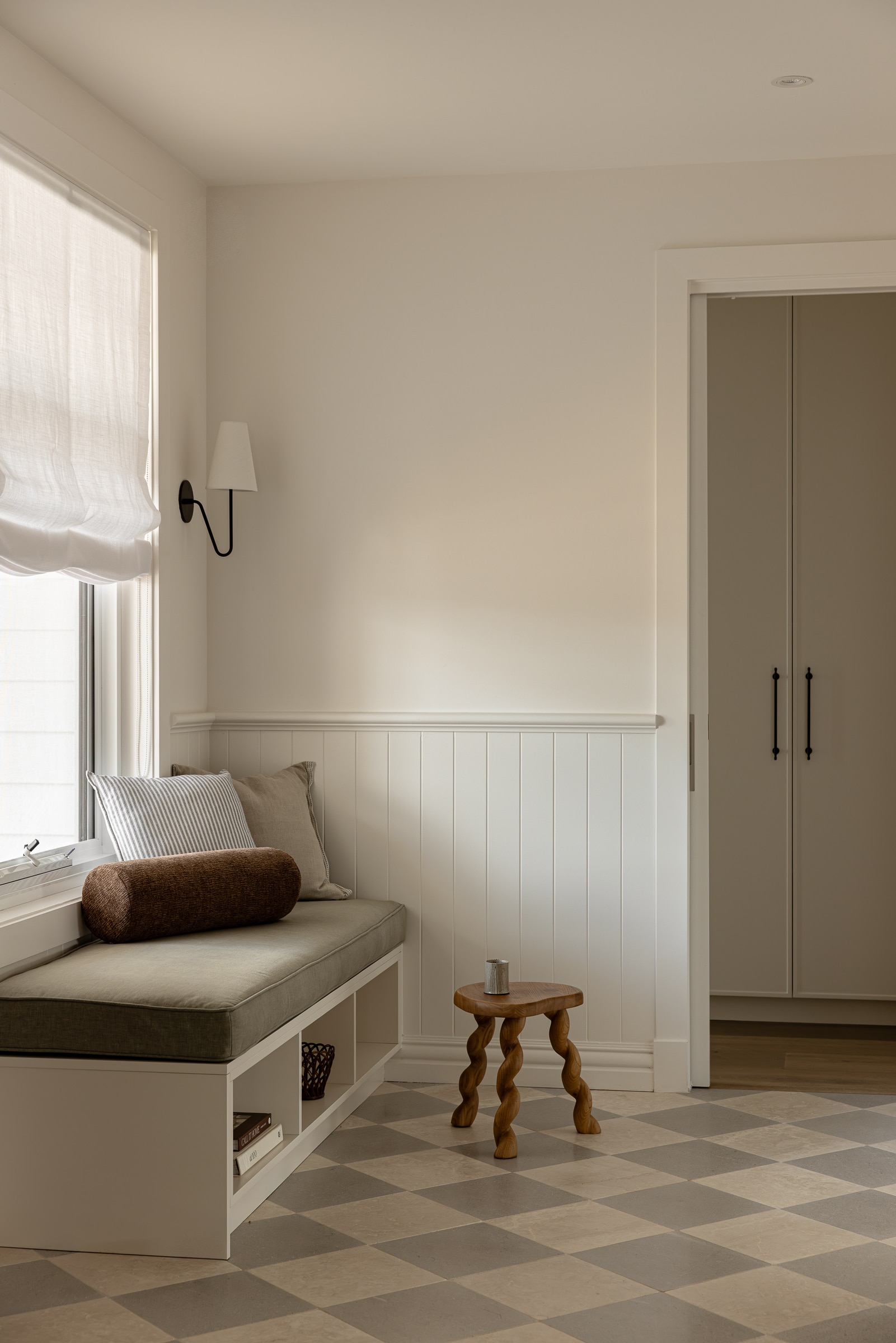 Sleek board and batten wainscoting used to accentuate a cosy nook within a contemporary federation style Australian interior.