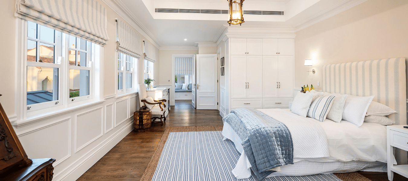 Hamptons style bedroom featuring SK505 skirting board profile with classic wall panelling and refined architectural detailing