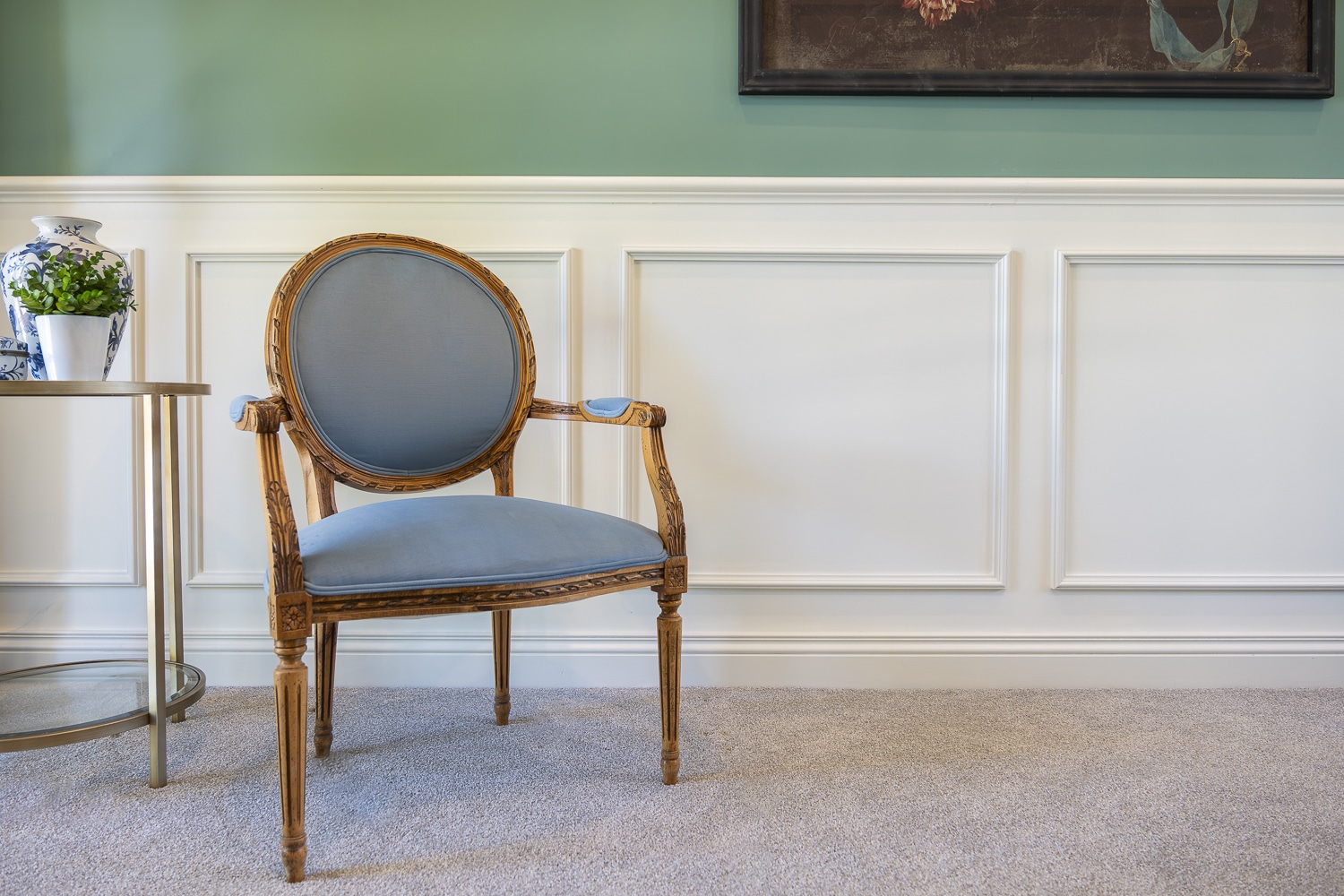 Classic interior featuring decorative wall panelling and dado rail mouldings with refined timber skirting in a heritage-inspired setting.