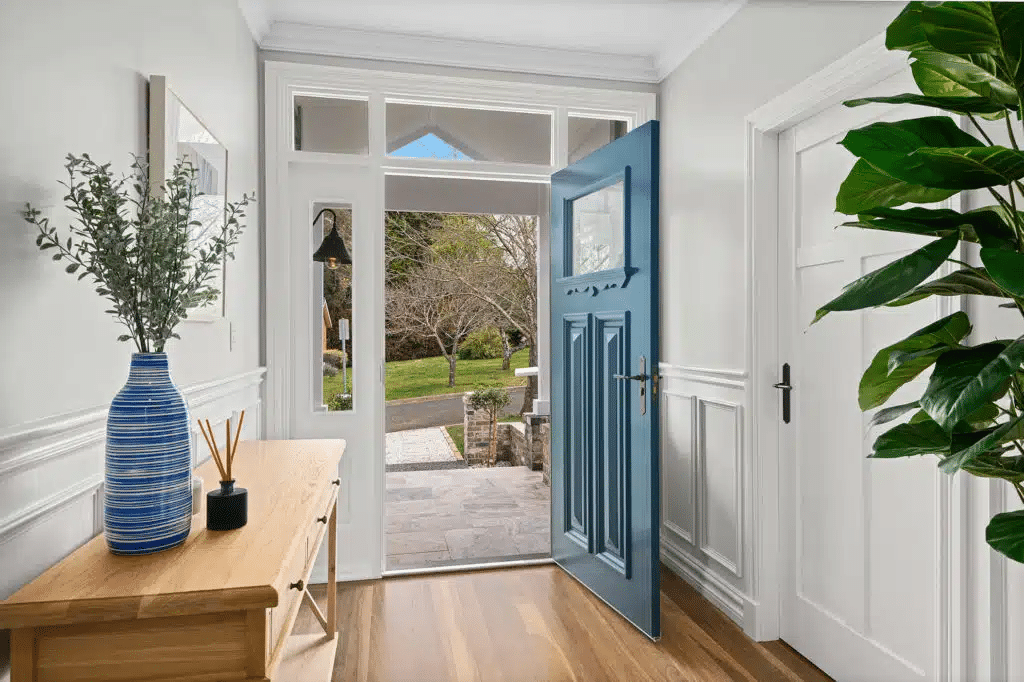 White wainscoting in a home entry that emphasises the interior