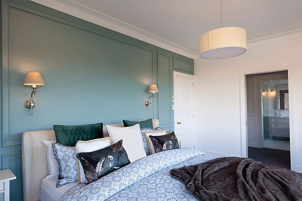 Example of green feature wall wainscoting in a bedroom space