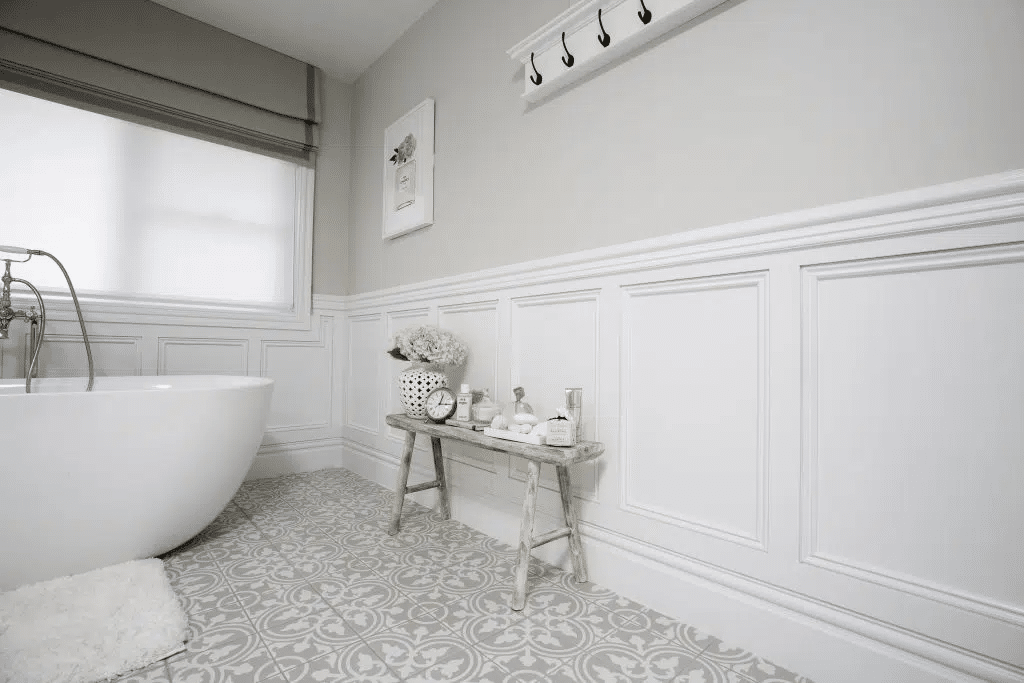 White bathroom example of stylish frame and panel wainscoting