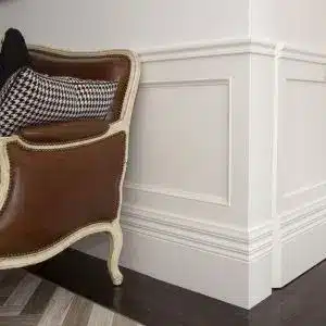 Timber chair rail moulding detail creating wall panelling feature in a traditional interior space