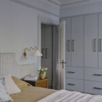 Bedroom with built-in wardrobes and detailed cornices in Victorian terrace renovation by Convict Interiors using Intrim skirting, architraves, and picture rail.