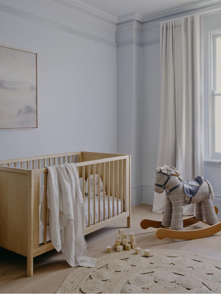 Nursery with timber cot and soft drapery in Victorian terrace Potts Point renovation by Convict Interiors, featuring Intrim picture rail, skirting and architraves.