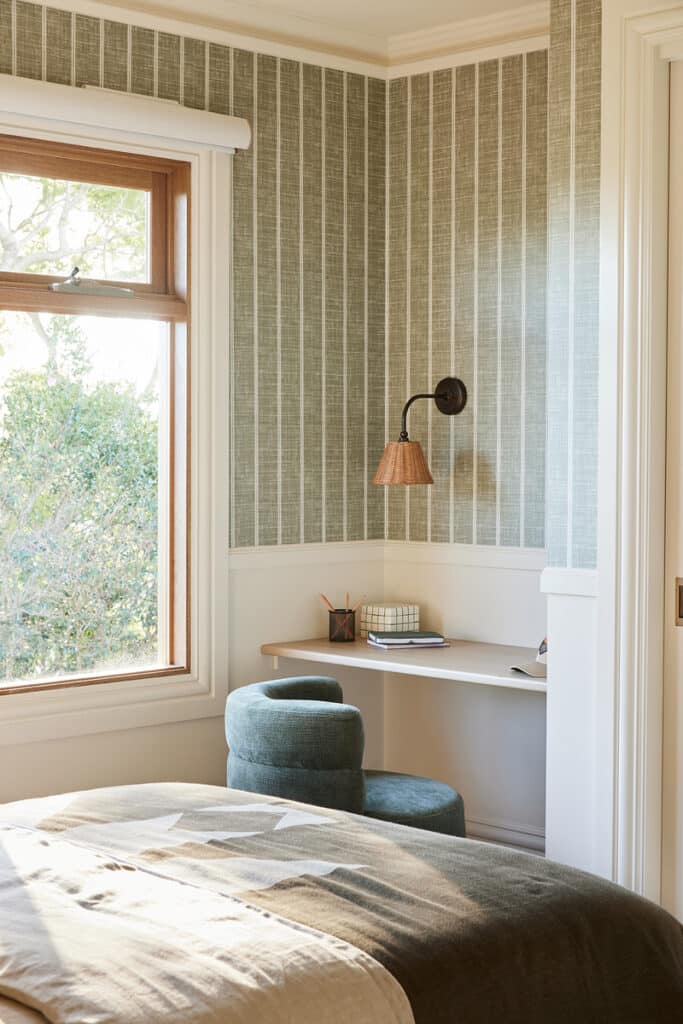 Bedroom study nook with textured wallcovering, Intrim SK09 chair rail, SK945B architraves and skirting, creating a refined French Country retreat.