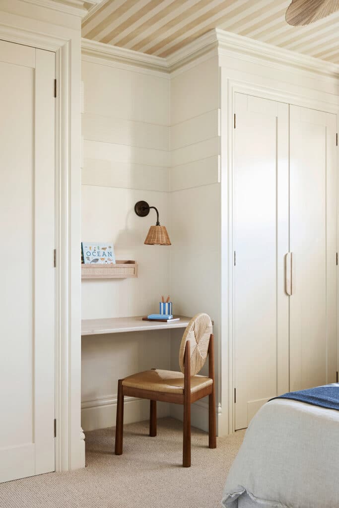 French Country bedroom study nook featuring Intrim SK945B skirting with LB35 fluted wall battens, creating a textured wall detail beneath a striped ceiling.