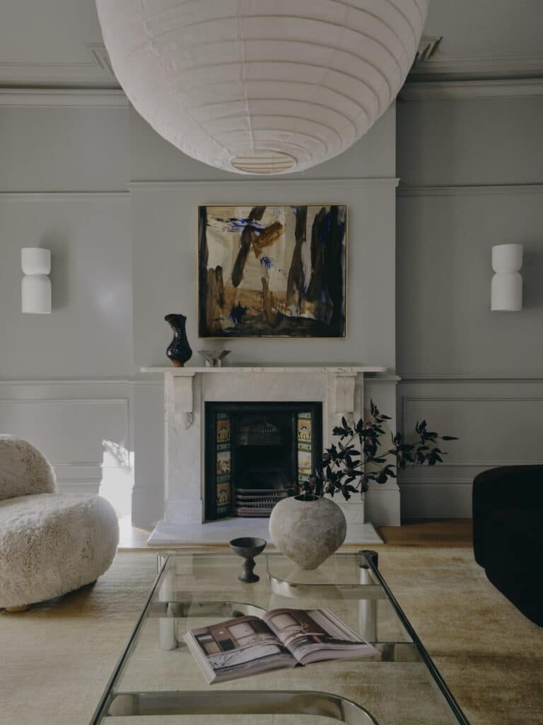 Restored front room, showing full-height skirting, wainscoting and the marble fireplace.