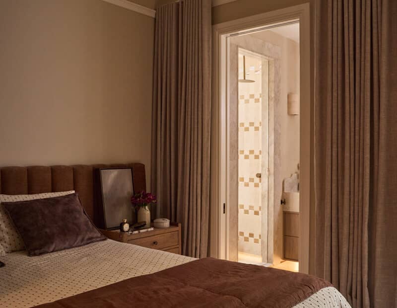 Heritage Japandi bedroom with layered neutral textiles, full-height curtains and Intrim SK450 architrave detail.