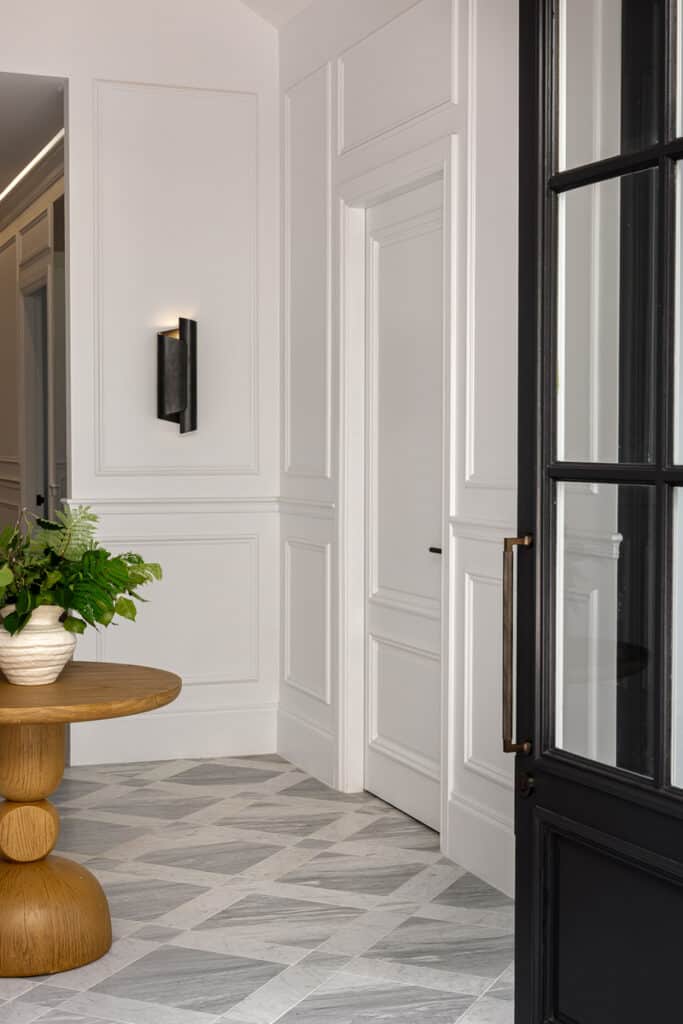 Contemporary farmhouse entry at Tallowwood Cobbitty featuring Intrim SK498 architraves, CR62 chair rail, IN23 inlay moulding and patterned stone flooring
